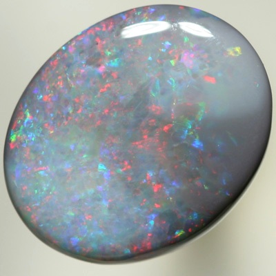 SOLID SEMI BLACK OPAL Red sparkles move over green and purple